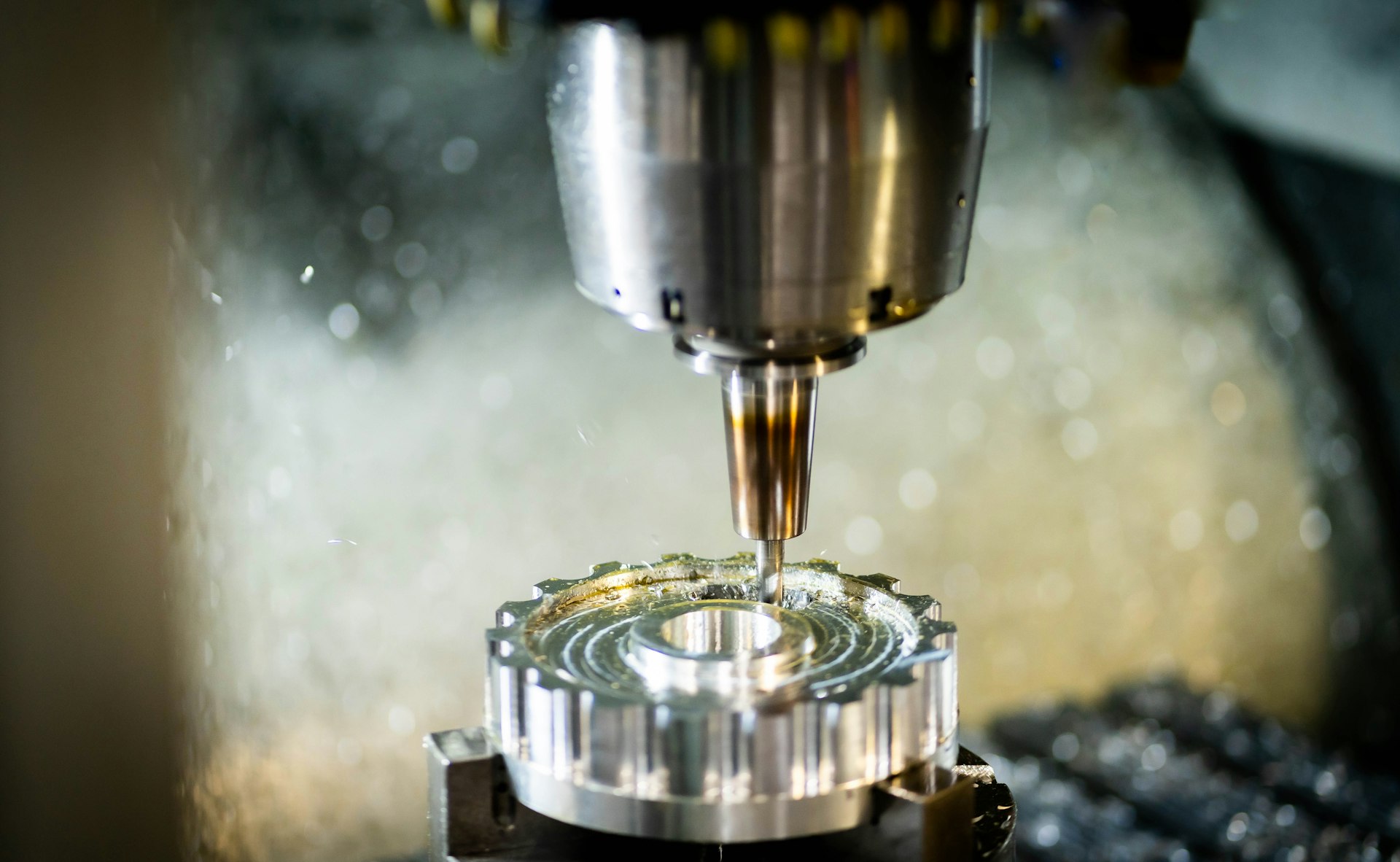 CNC milling machine cutting an aerospace component at UD Manufacturing in Arkansas